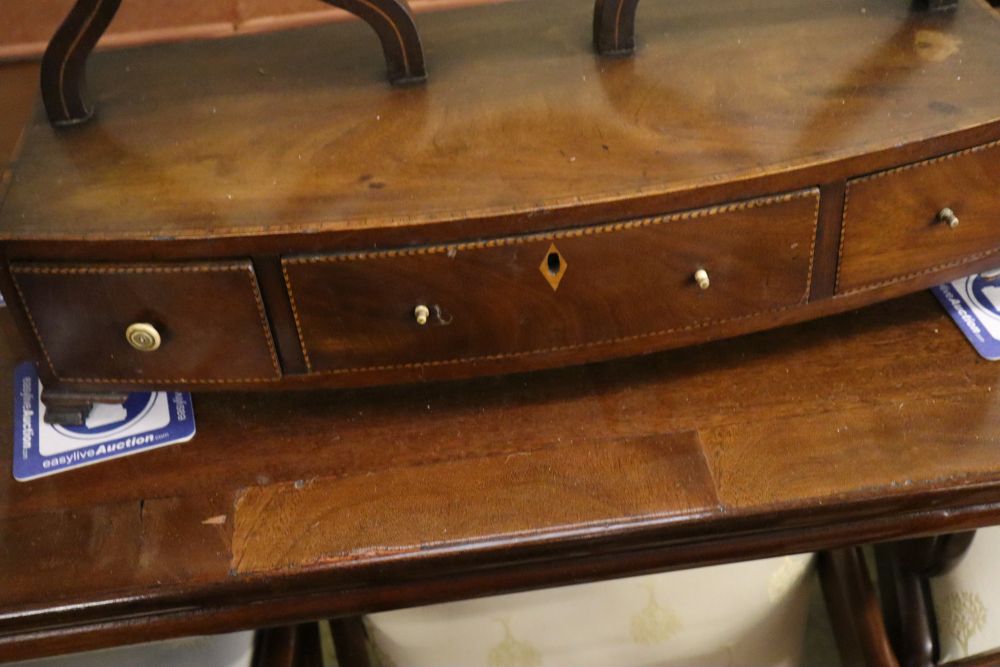 A George III mahogany toilet mirror with bow front box base, width 55cm, depth 22cm, height 72cm